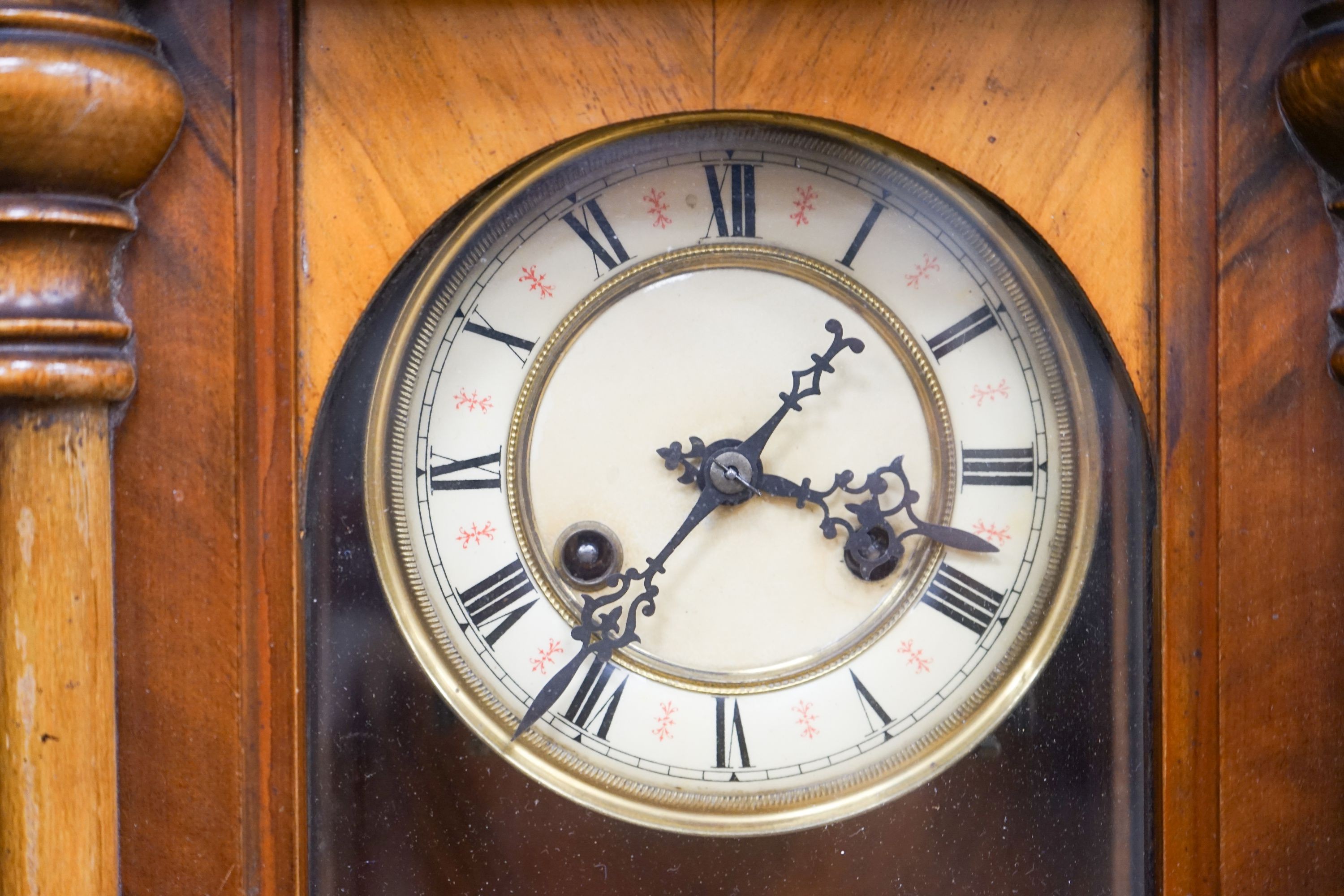 A small late 19th century Vienna wall clock, fitted with an eight day striking movement